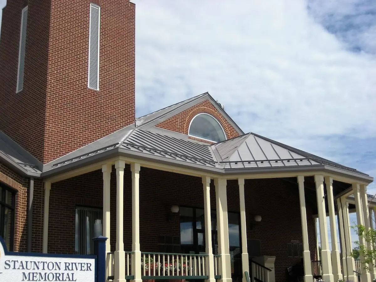 Skilled roofing craftsmen working on a residential roof in Fargo